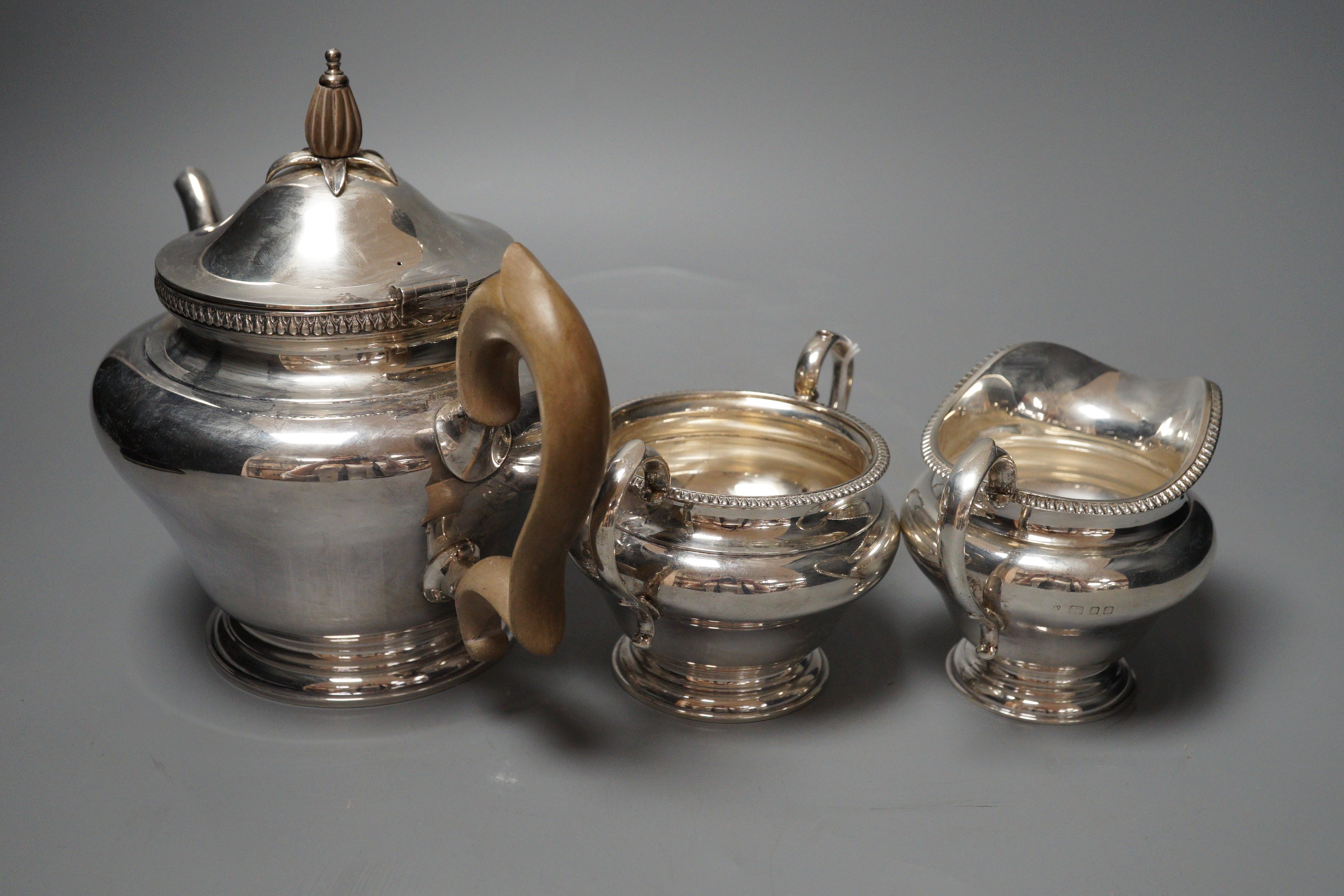 A George V silver inverted pear shape three piece tea set, Edward Barnard & Sons Ltd, London 1928/9